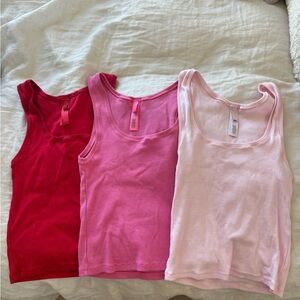 SKIMS Red, Pink, and Light Pink Tank Tops